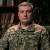 thumb-Vadym Pryimak in military uniform against the background of bookshelves